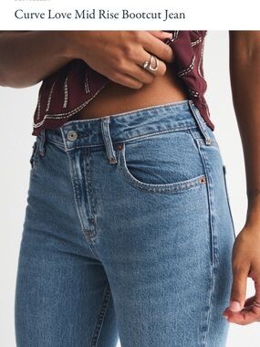 Abercrombie Curve Love Mid-Rise Bootcut Jeans in Medium Blue